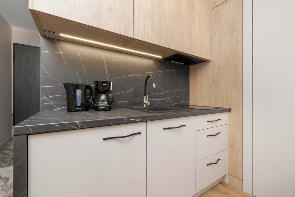 The fully equipped kitchenette includes everything you need for a home-cooked meal.
