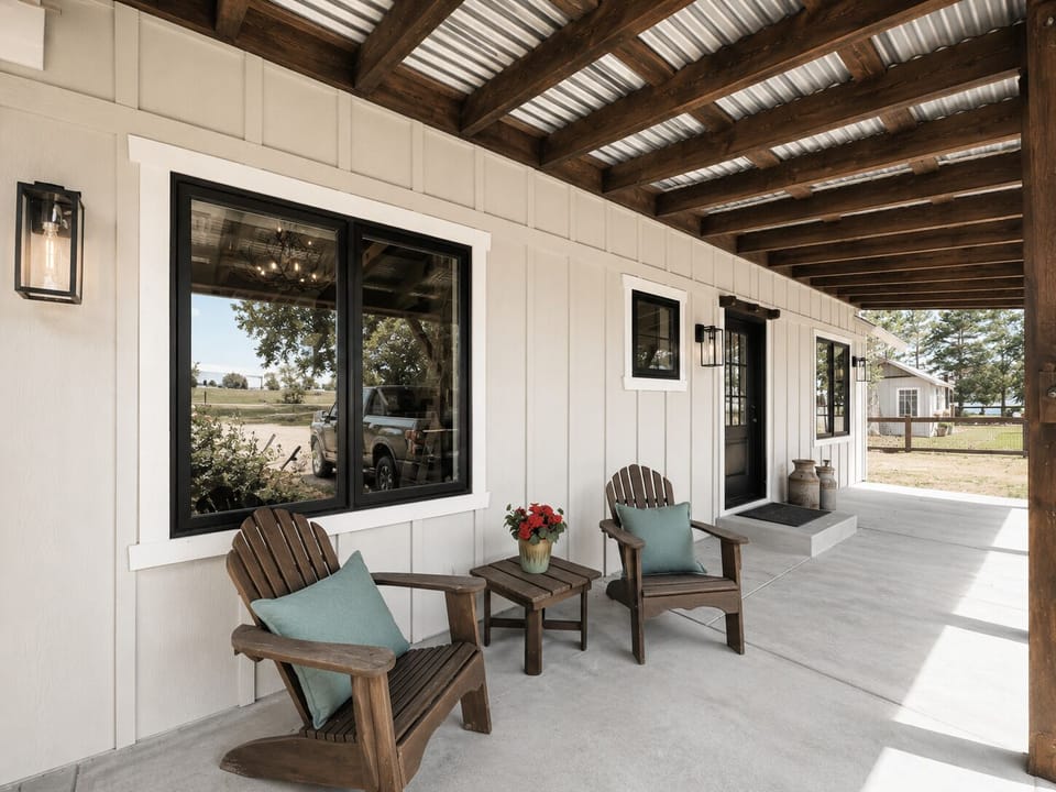 Settle into your own covered outdoor retreat with comfortable seating, rustic charm, and peaceful country views stretching beyond. Perfect for morning coffee or quiet evenings under the pergola.
