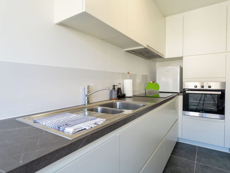 Kitchen, Countertop, Kitchen Appliance, Interior Design, Flooring, Major Appliance, Cabinetry, Wood, Kitchen Sink, Floor