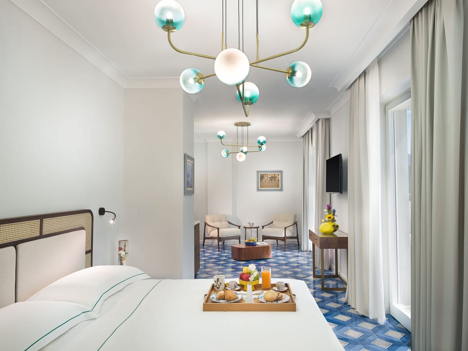 Deluxe Suite, Sea View | Premium bedding, minibar, in-room safe, blackout drapes