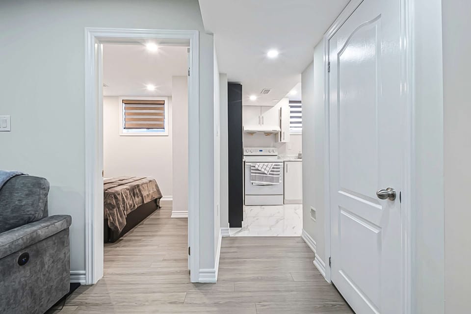 Walkway leading from the living room to the bedroom and kitchen