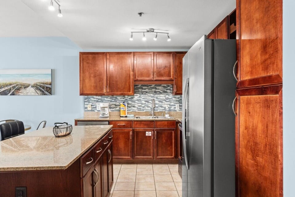 Fully Stocked Kitchen with Stainless Steel Appliances, Island Bar Seating and Drip Coffee Maker