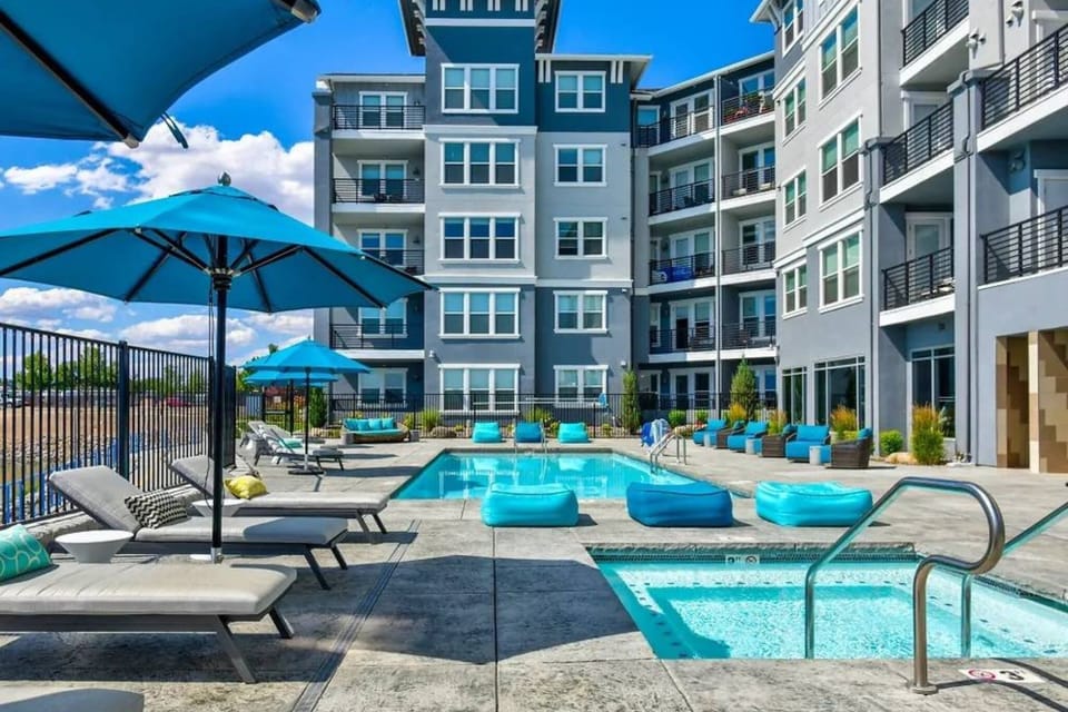 Relax poolside all year long with a heated pool and jacuzzi overlooking the waterfront—pure vacation vibes.