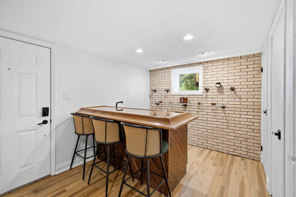 Wet bar near the rec room keeps refreshments within easy reach.