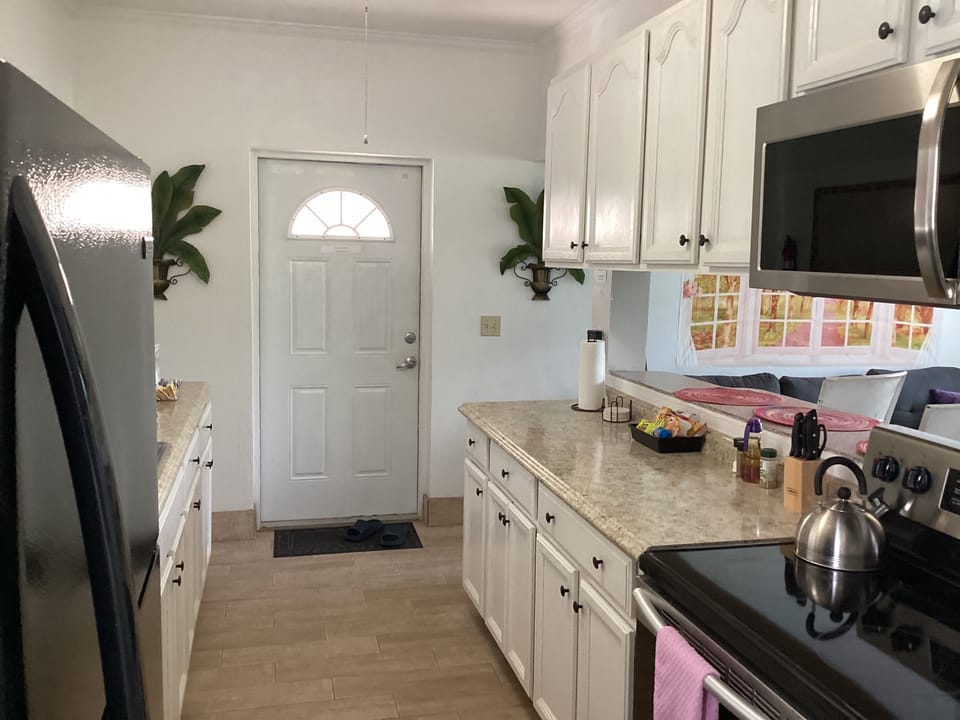 Condo, Non Smoking, Garden View | Private kitchen | Coffee/tea maker, full-size fridge, microwave, oven