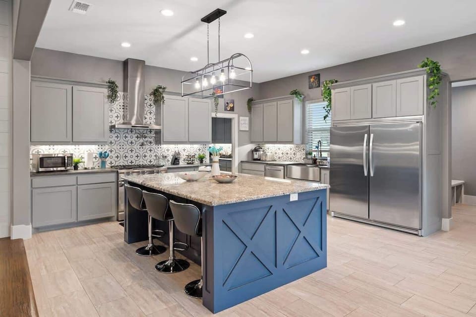 Cook, gather, and connect in this stunning chef’s kitchen with a spacious island.