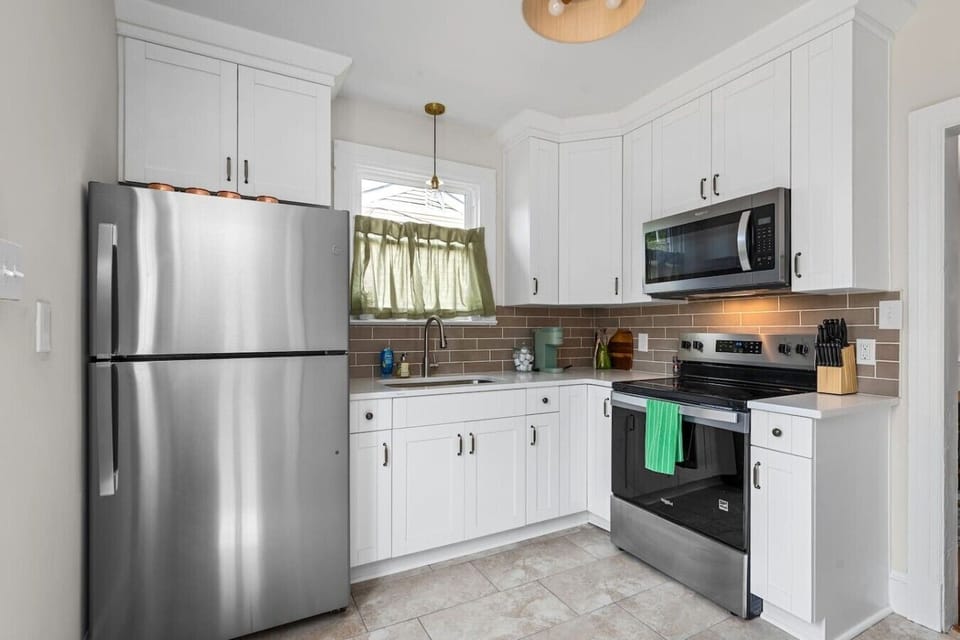 This freshly renovated kitchen offers everything you need, from an electric stove and microwave to a Keurig and full fridge/freezer. With easy access to the upstairs loft and dining area, it’s designed for convenience and connection.