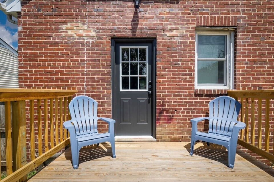 Step off the kitchen onto a peaceful back deck with two lounge chairs—perfect for morning coffee or unwinding at sunset.