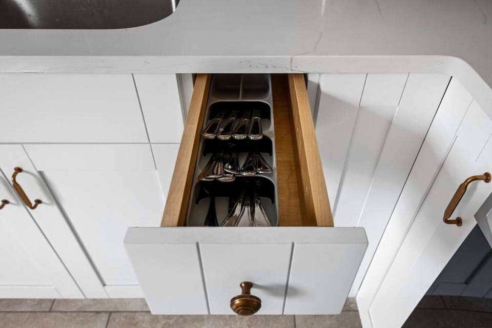 This freshly renovated kitchen offers everything you need, from an electric stove and microwave to a Keurig and full fridge/freezer. With easy access to the upstairs loft and dining area, it’s designed for convenience and connection.