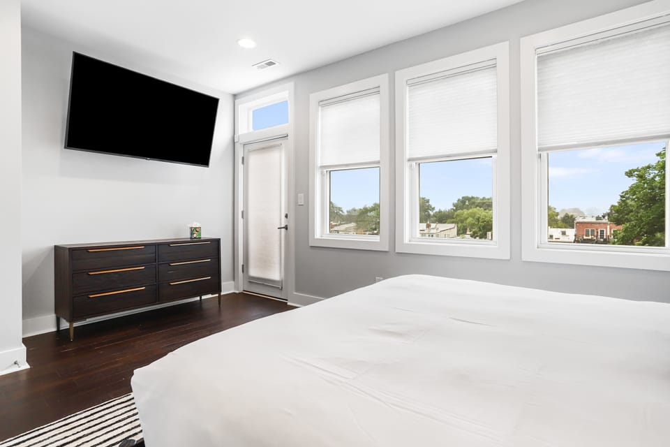 Sunlit king bedroom with en-suite bathroom