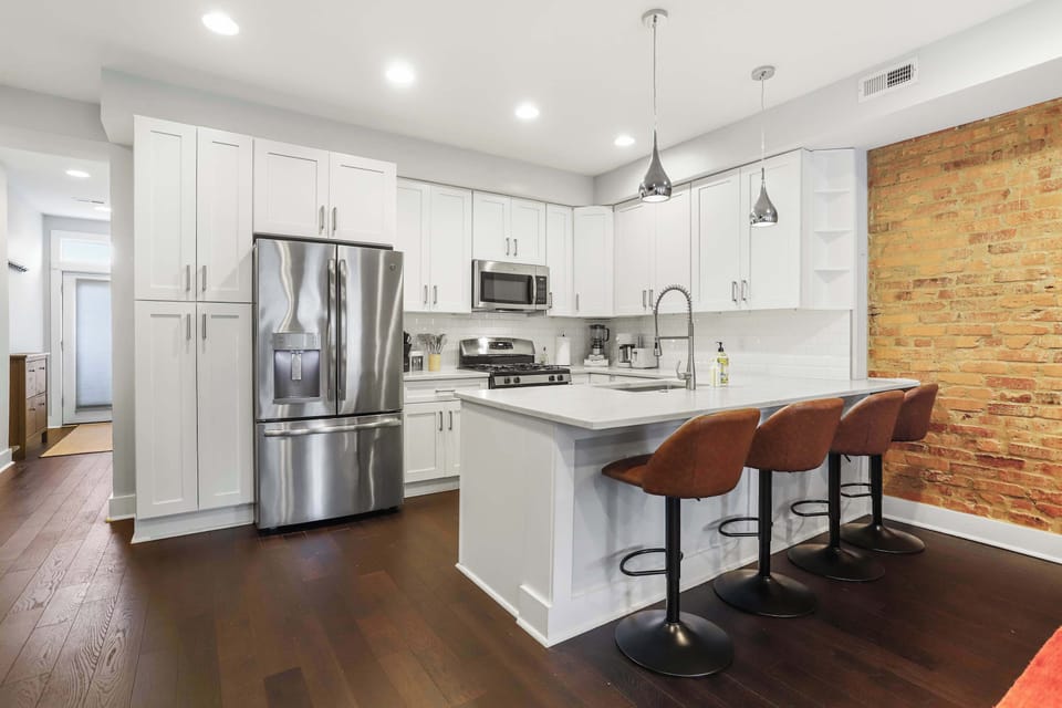 Modern, updated kitchen equipped with full-size appliances, cookware, and everything for home-cooked meals 