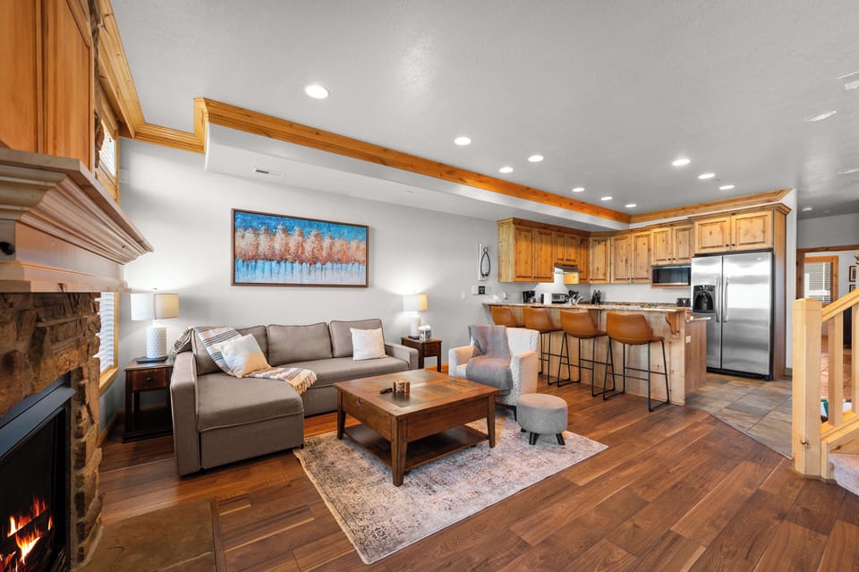 Spacious open living area connecting the kitchen, dining, and lounge spaces.