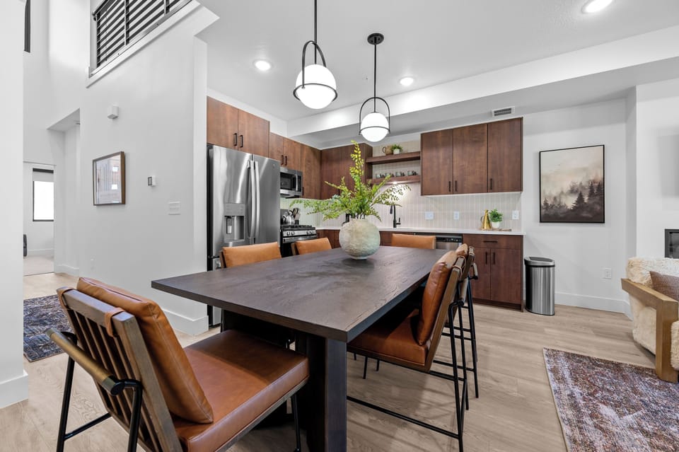 Modern kitchen with dining table seating and easy access to the living area.