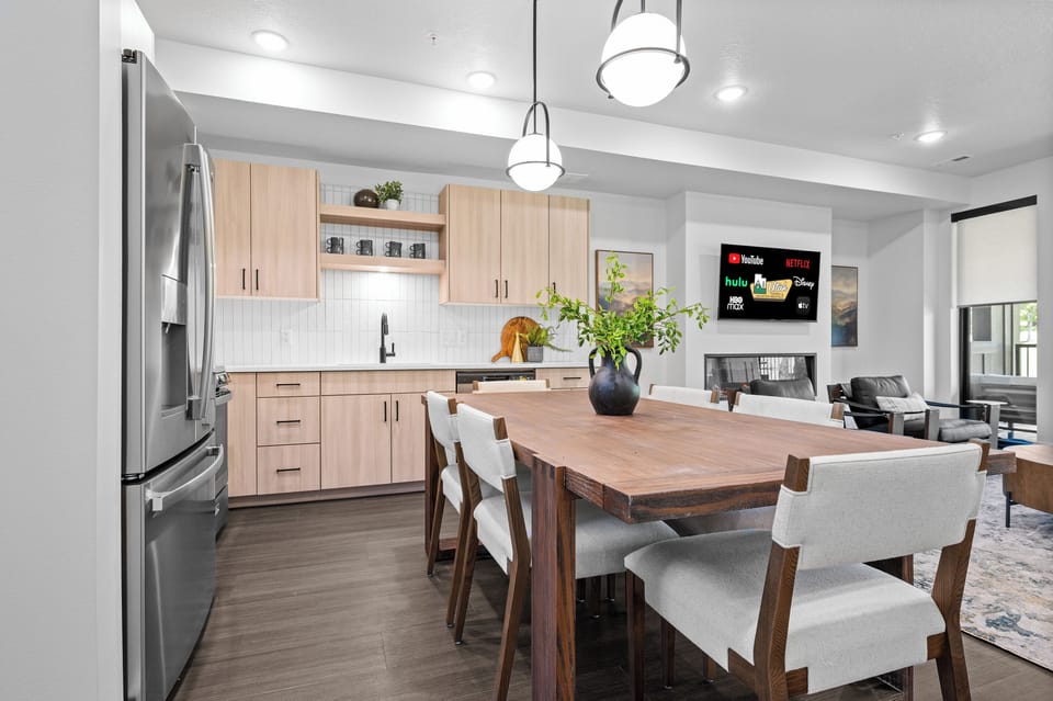 Gather around the dining table for meals, games, and conversation.