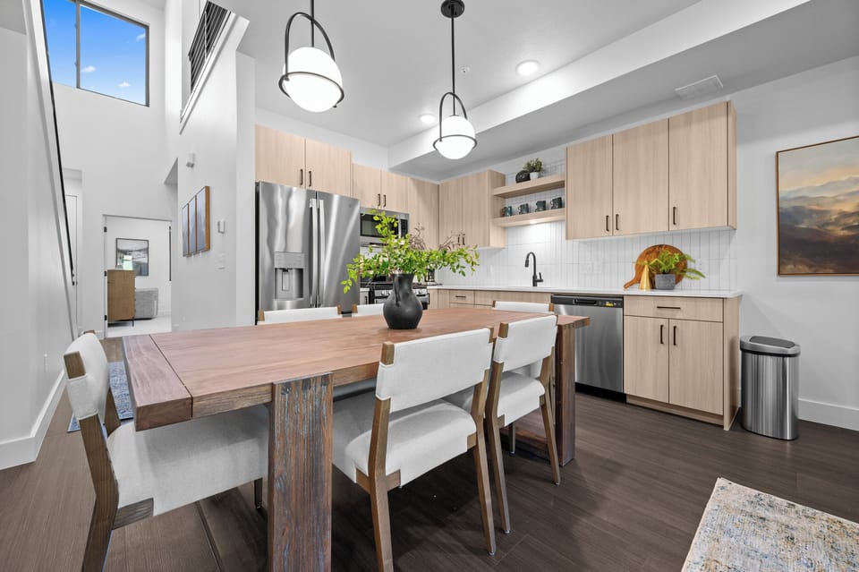 Modern mountain kitchen with soaring ceilings and abundant natural light.