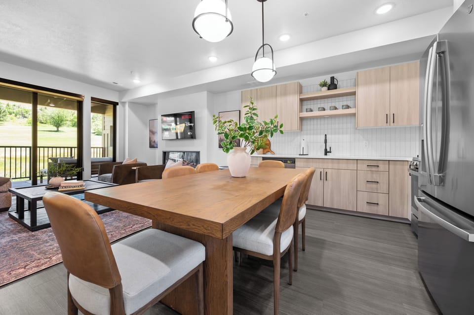 Open dining area with easy access to the kitchen and balcony.