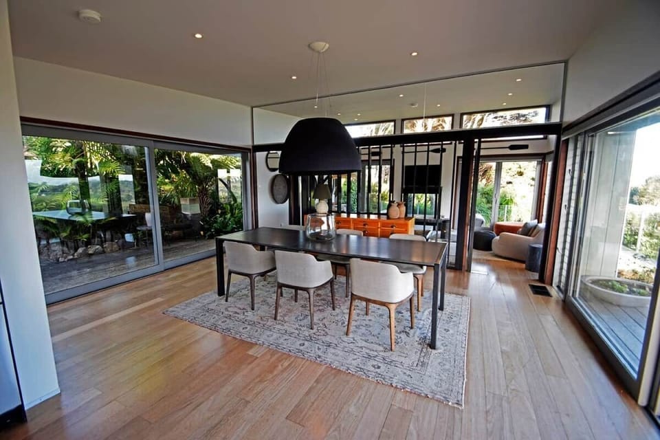 Both indoor and outdoor dining areas have seating for six, with four bar stools also available at the kitchen island for casual meals and snacking.