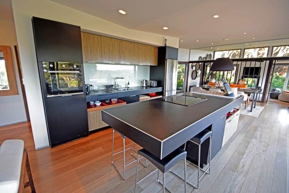 The kitchen is very well equipped with all the modern conveniences of home, including a full refrigerator with freezer drawer, microwave, dishes & cutlery, kettle, induction stove top, toaster, glassware, espresso machine, and more.