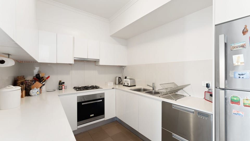 Everything you need for home cooking is at your fingertips in this bright, functional kitchen.