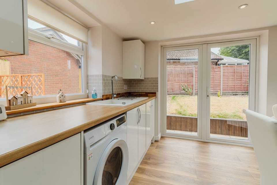 Kitchen area looking out into the back garden from the French doors there 