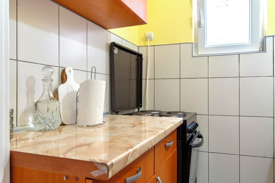 Kitchen with stove, fridge and microwave for easy family meals.