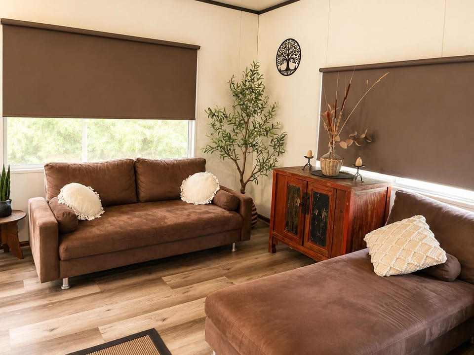 Unwind in the cosy living area, where comfort, warmth and peace await