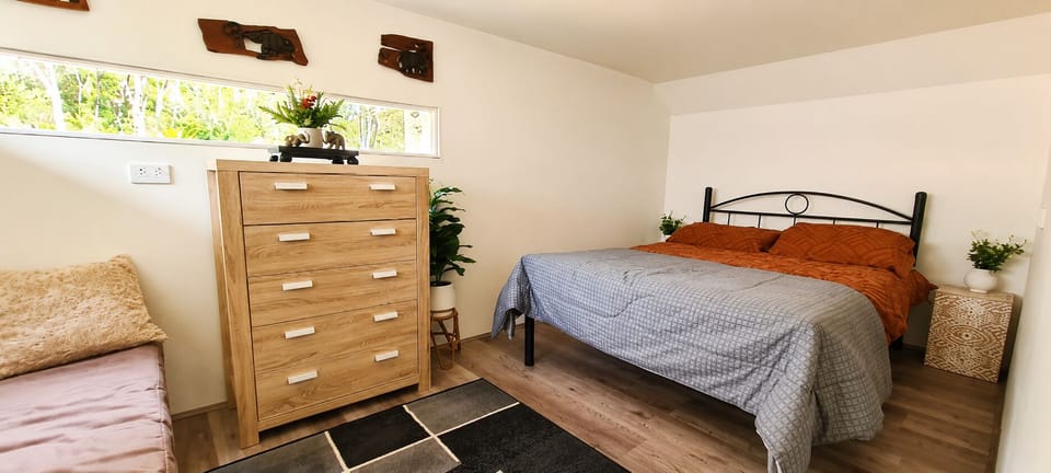 The cosy second bedroom features a comfortable double bed, perfect for a peaceful night's sleep