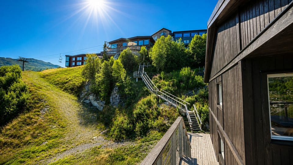 The ski slopes are green and lushes in the summer