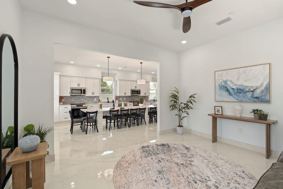 Bright lounge nook with modern decor and an open view into the kitchen.