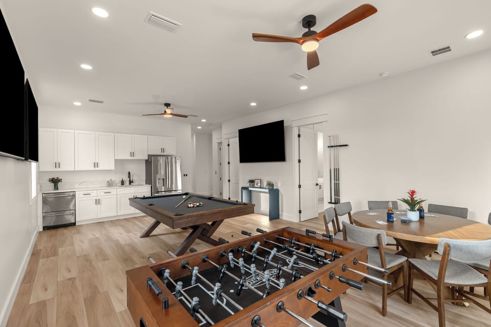Game room with pool table, foosball, kitchenette, and plenty of space for group hangouts.