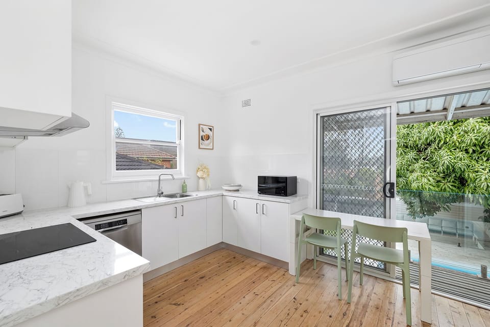 Kitchen Area with seating and balcony shot