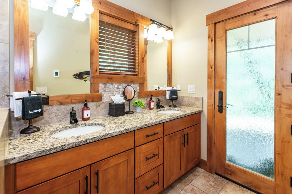 The spacious ensuite features dual vanities, making mornings easy for couples as well as easy access to the back patio.