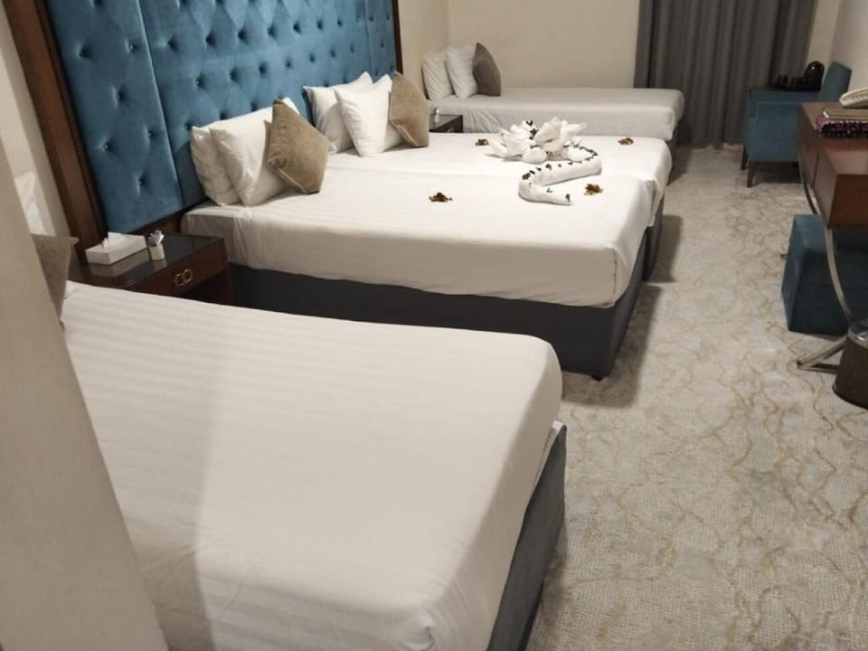 Deluxe Quadruple Room | Premium bedding, minibar, in-room safe, desk