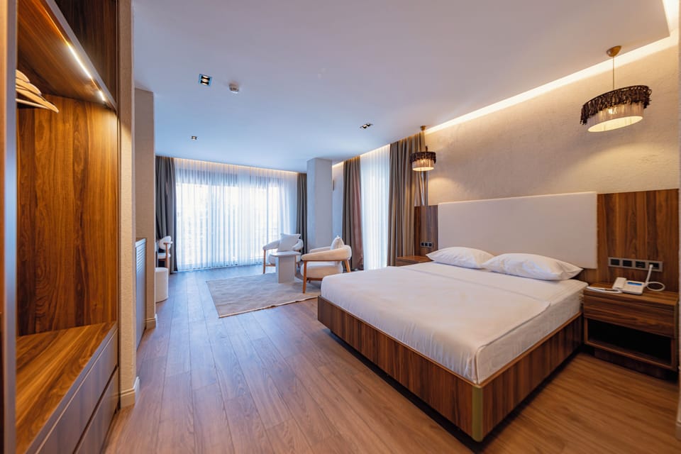 Deluxe Suite, Garden View | Blackout drapes, soundproofing, iron/ironing board (on request)
