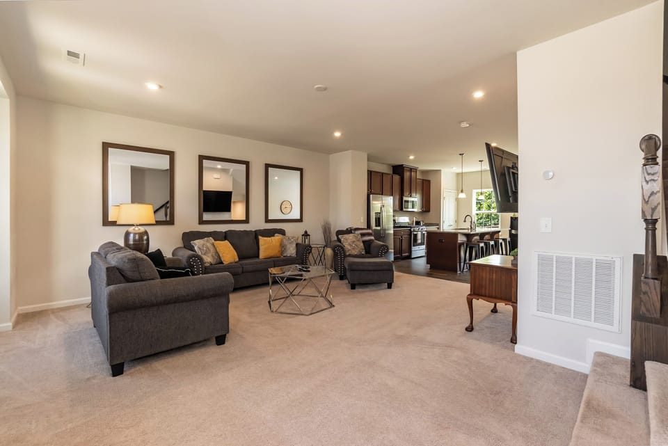 Open to the kitchen and dining area