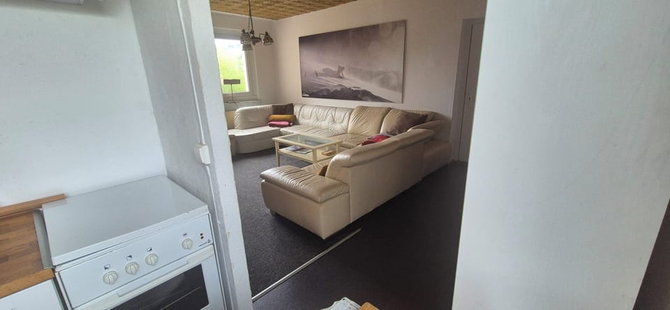 Cozy lounge with large sectional sofa and bright, inviting ambiance