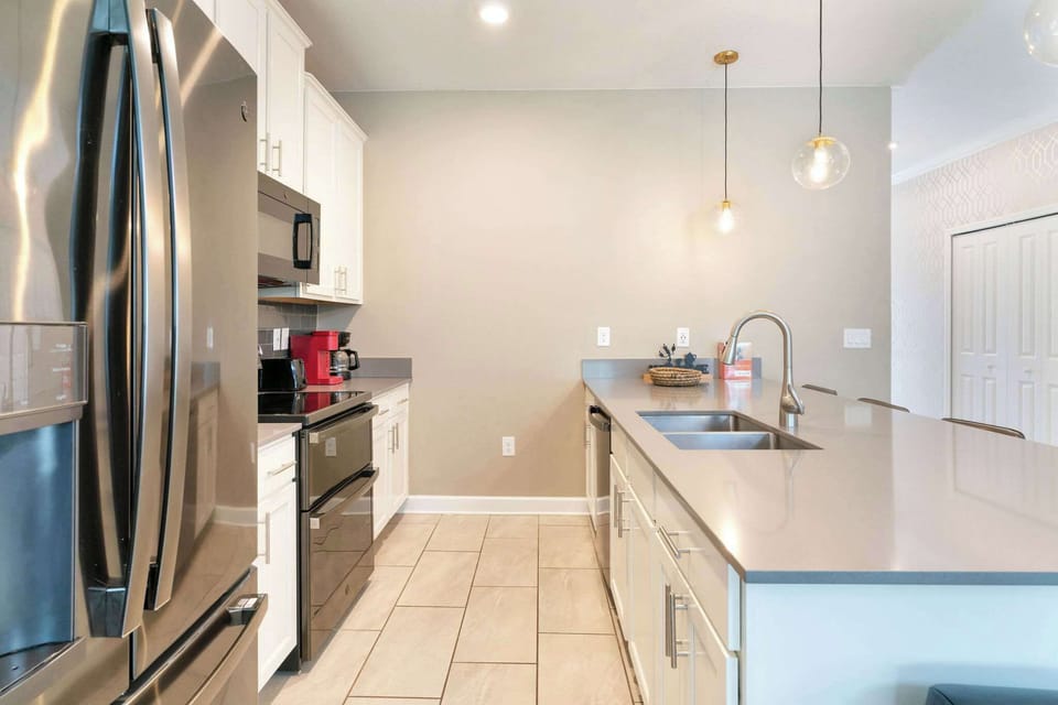 Cook, snack, and gather with ease in a bright kitchen with plenty of counter space for vacation meals.