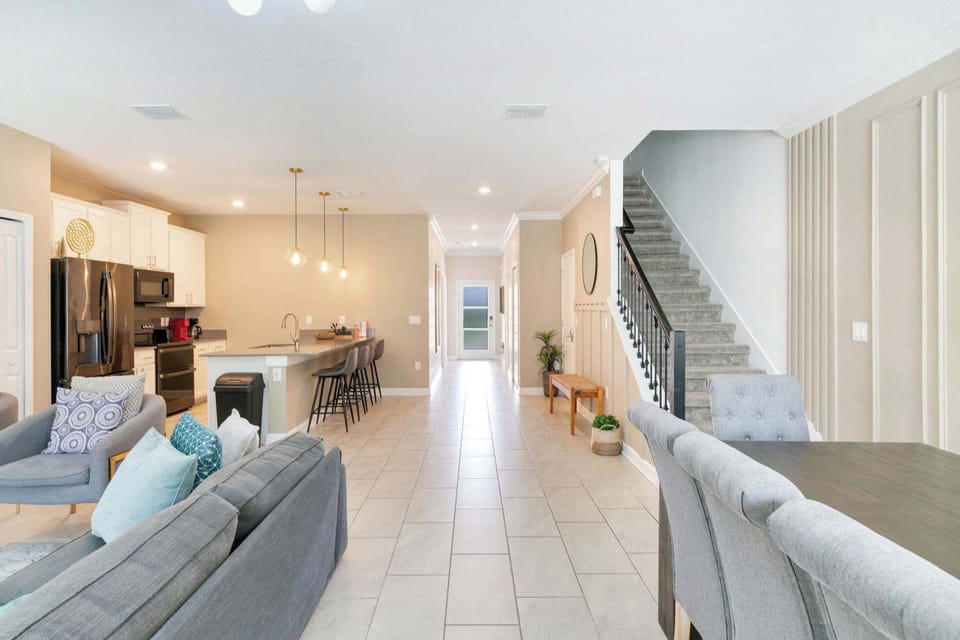 The spacious open-concept layout keeps the kitchen, dining, and living areas connected for easy group stays.