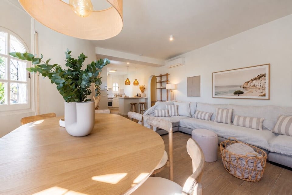 Open living room connected to kitchen and dining area