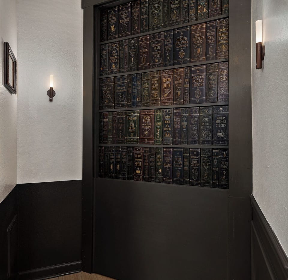 Discover the secret bookshelf doorway—one of the home’s most magical surprises, leading into the immersive Forest Suite beyond.