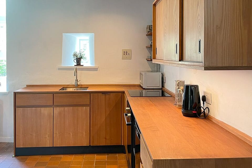Hand-crafted kitchen inspired by the 1960's original, includes dishwasher.