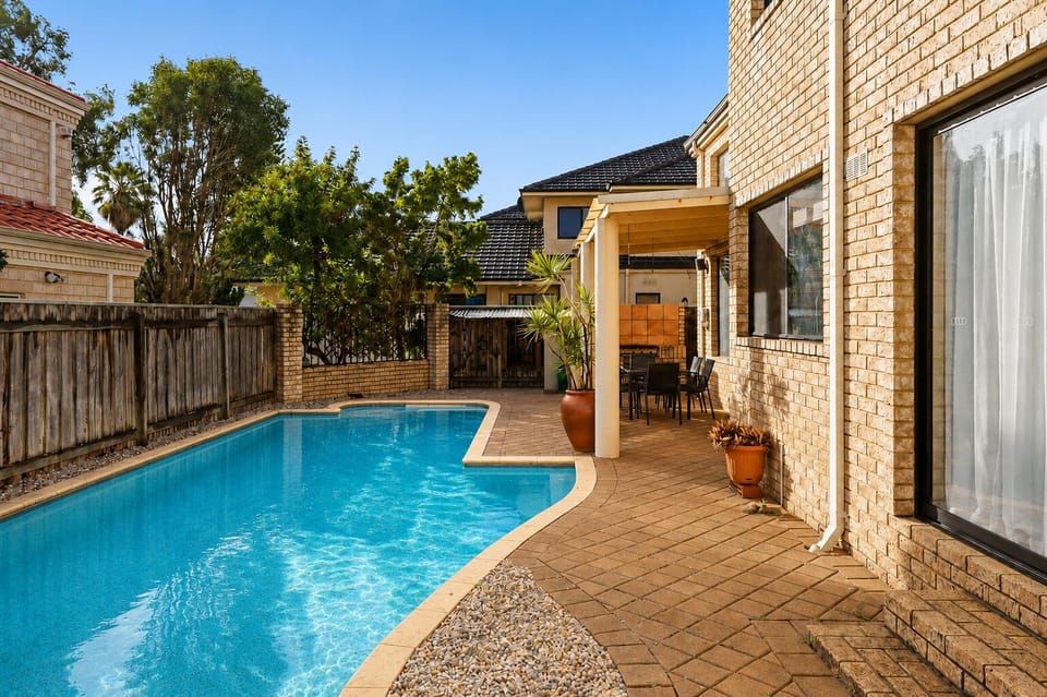 With direct access to the pool and a comfortable outdoor dining area, this space is designed for ultimate relaxation and entertaining.
