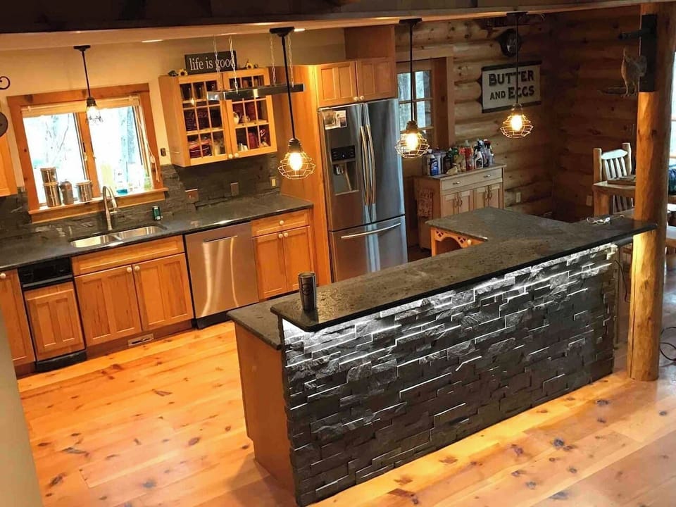 Fully stocked kitchen with (3) barstools.  