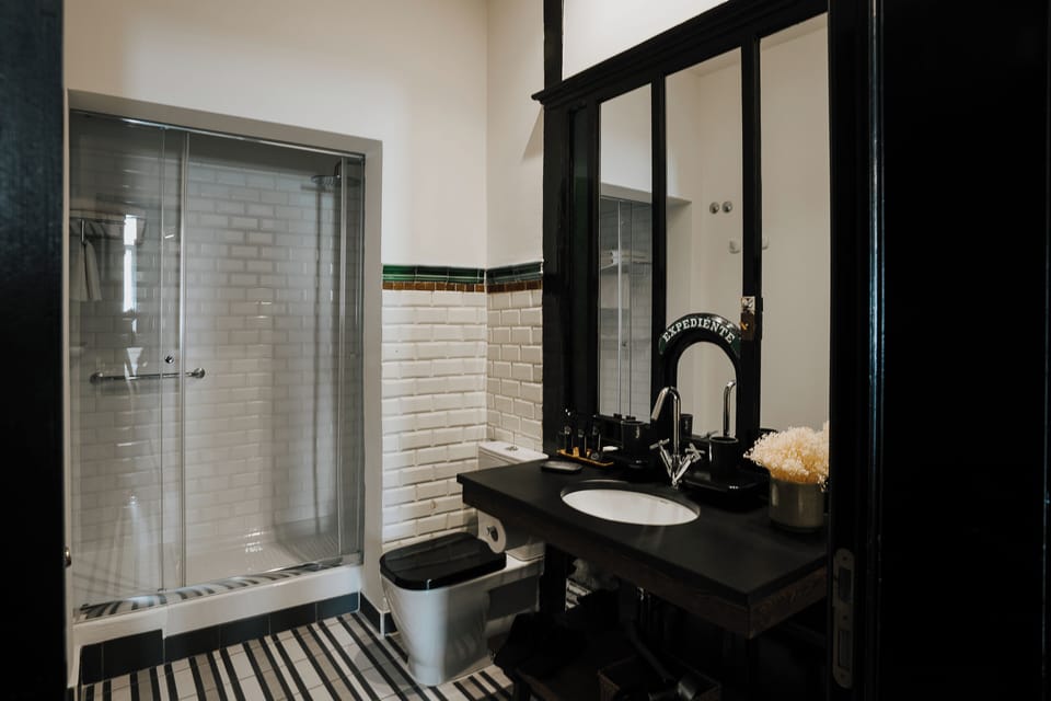 Deluxe Room (Square View) | Bathroom | Shower, designer toiletries, hair dryer, slippers