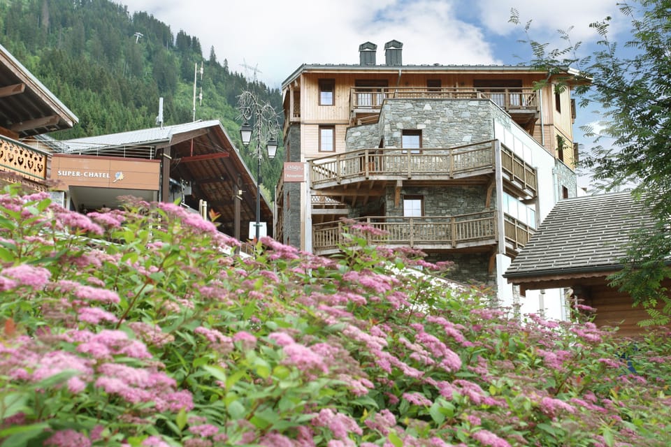 Summer in Châtel brings lush Alpine meadows and the gondola stays busy with hikers and paragliders heading into the Portes du Soleil.