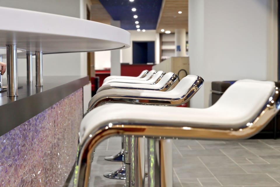 Bar seating at the heart of the residence, a casual spot to swap stories from the pistes over a cold drink.