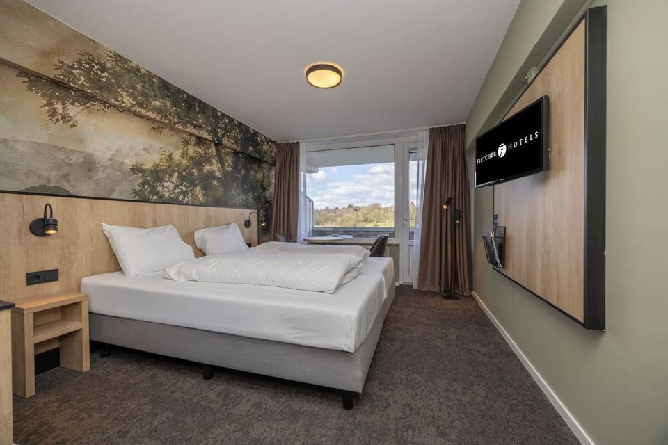 Rinse off under the rainfall shower in a polished suite.