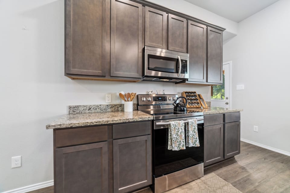 Modern kitchen with stainless appliances and ample counter space