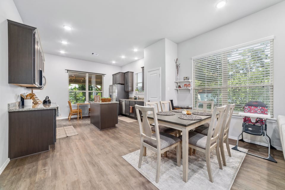 Bright open kitchen and dining space with island and natural light
