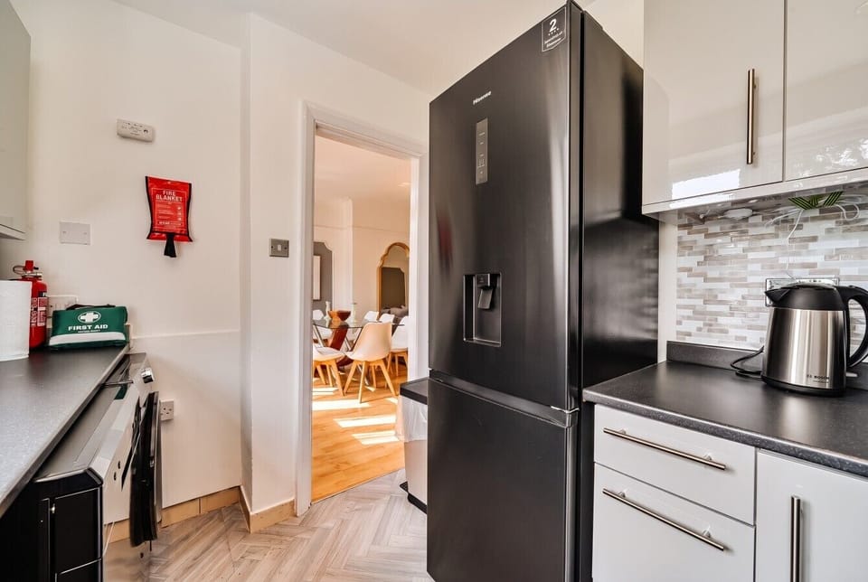 Well-equipped kitchen with kettle, first aid and easy dining access